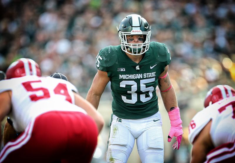 Oct 21, 2017; East Lansing, MI, USA; Michigan State Spartans linebacker Joe Bachie (35) looks over the offense during the first quarter of a game against the Indiana Hoosiers at Spartan Stadium. Mandatory Credit: Mike Carter-USA TODAY Sports