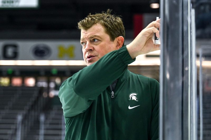 Michigan State's head coach Adam Nightingale talks with the team in practice during hockey media day on Wednesday, Sept. 27, 2023, at Munn Arena in East Lansing.