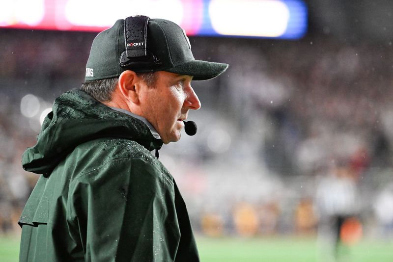 Sep 21, 2024; Chestnut Hill, Massachusetts, USA; Michigan State Spartans head coach Jonathan Smith watches from the sideline during the first half against the Boston College Eagles at Alumni Stadium. Mandatory Credit: Eric Canha-Imagn Images