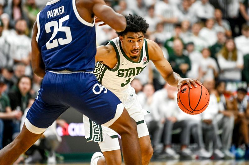 Michigan State's Jaden Akins moves the ball as Georgia Southern's Avantae Parker defends during the second half on Tuesday, Nov. 28, 2023, at the Breslin Center in East Lansing.