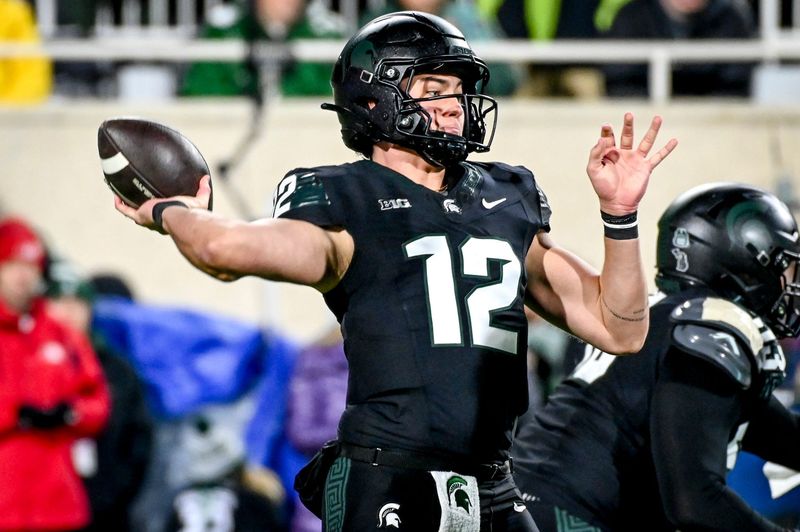 Michigan State's Katin Houser throws a pass against Michigan during the second quarter on Saturday, Oct. 21, 2023, at Spartan Stadium in East Lansing.