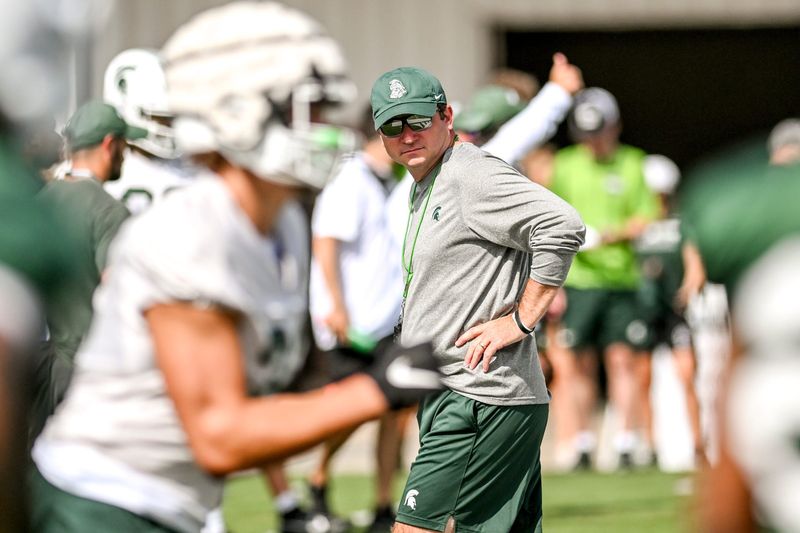 Michigan State's head coach Jonathan Smith looks on during the first day of football camp on Tuesday, July 30, 2024, in East Lansing.