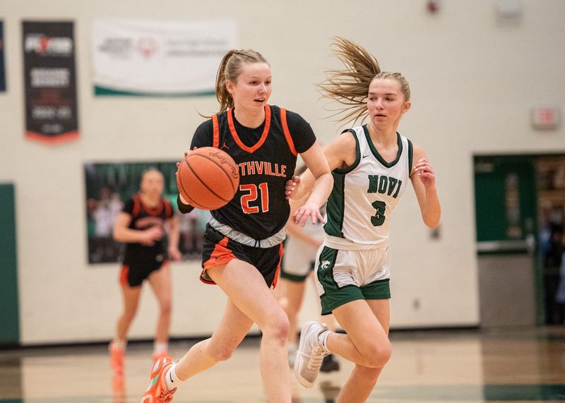 Northville's Sophia Fraas dribbles in transition during a Kensington Lakes Activities Association-West girls basketball game on Monday, Feb. 17, 2025.