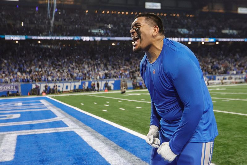 Detroit Lions offensive tackle Penei Sewell (58) celebrates 31-23 win over Tampa Bay Buccaneers at the NFC divisional round at Ford Field in Detroit on Sunday, Jan. 21, 2024.