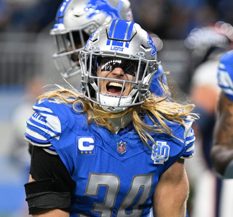 Dec 16, 2023; Detroit, Michigan, USA; Detroit Lions linebacker Alex Anzalone (34) celebrates after a sack by defensive end Josh Paschal (not pictured) against Denver Broncos quarterback Russell Wilson (not pictured) in the second quarter at Ford Field. Mandatory Credit: Lon Horwedel-USA TODAY Sports