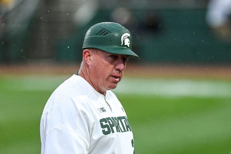 Michigan State's coach Jake Boss Jr. looks on during the sixth inning in the game against Michigan on Friday, April 15, 2022, at Jackson Field in Lansing.

220415 Msu Mich Baseball 144a