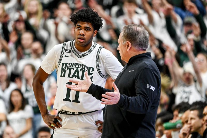 Michigan State's head coach Tom Izzo, right, talks with Jase Richardson during the first half in the game against Wisconsin on Sunday, March 2, 2025, at the Breslin Center in East Lansing.