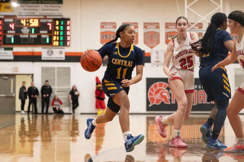 Battle Creek Central senior A'Mya Hodges dribbles during a playoff game against Coldwater at Sturgis High School on Friday, March 7, 2025.