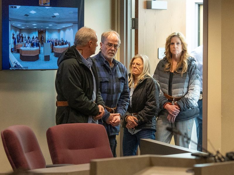 Gary Marken, Jeffrey Alan Mosteller, Aleta Harward Moffitt and Tamela Peterson, CEO of the Oxford Center are led into the courtroom to be arraigned in front of Magistrate Elizabeth Chiappelli at the Oakland County 52-4 District Court in Troy on Tuesday, March 11, 2025, in the death of Thomas Cooper, 5, in a hyperbaric chamber.