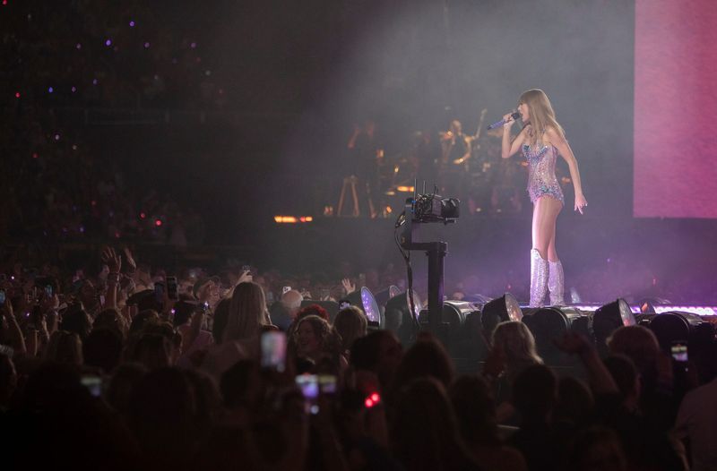 Taylor Swift performs on stage in front of thousands of fans inside Ford Field in Detroit on Friday, June 9, 2023.