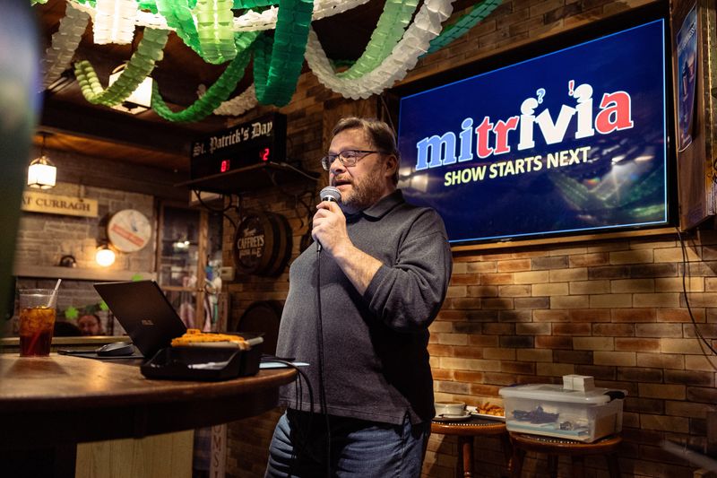 Steve Ralph, from MI Trivia, welcomes guests before starting trivia night at The Curragh Irish Pub on March 13, 2025, in Holland.