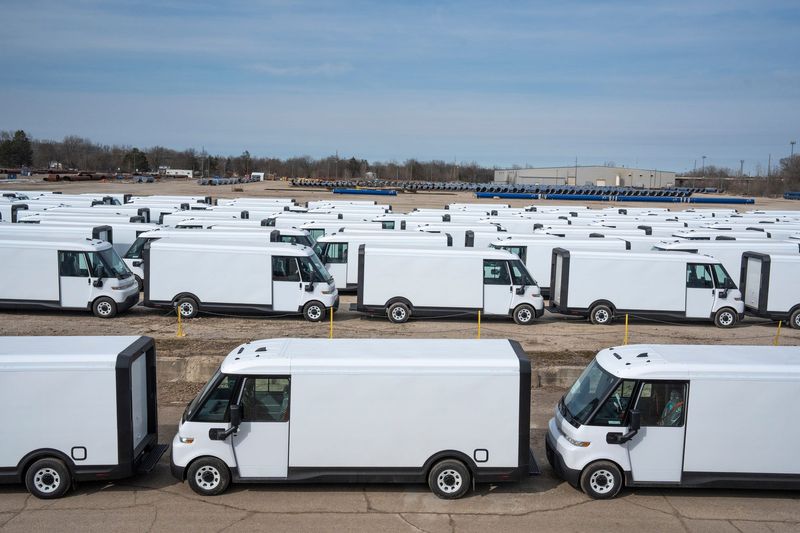 A smaller section of BrightDrop EV delivery vans are stored in rows in a lot in Flint on Wednesday, March 12, 2025.