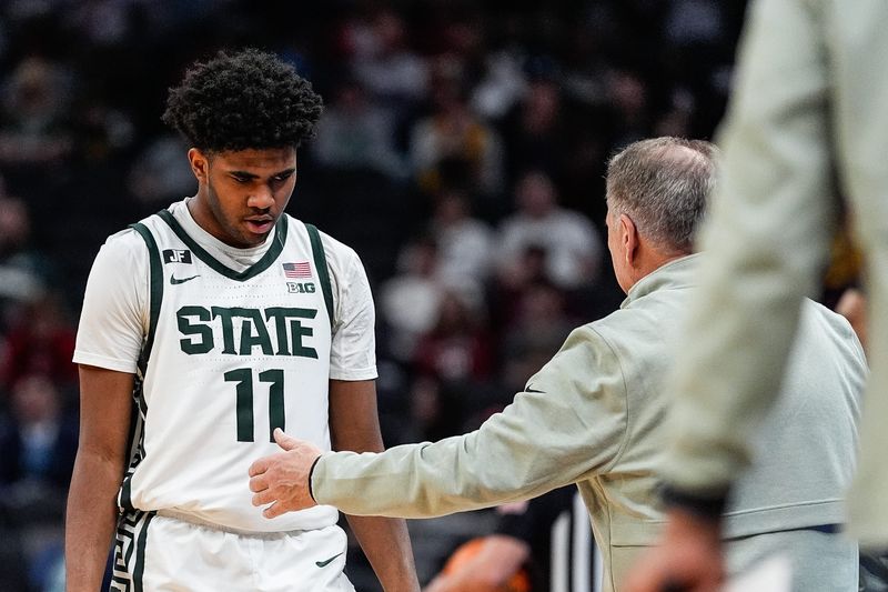 Michigan State guard Jase Richardson (11) walks off the court for substitution against Wisconsin during the second half of Big Ten Tournament semifinal at Gainbridge Fieldhouse in Indianapolis, Ind. on Saturday, March 15, 2025.