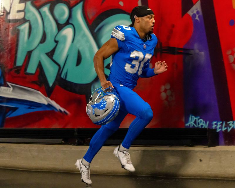 Nov 17, 2024; Detroit, Michigan, USA; Detroit Lions cornerback Khalil Dorsey (30) runs up the tunnel to the lockeroom after the game against the Jacksonville Jaguars at Ford Field. Mandatory Credit: David Reginek-Imagn Images