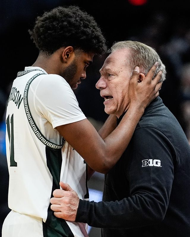 Michigan State freshman guard Jase Richardson hugs head coach Tom Izzo to celebrate the 71-63 win over New Mexico in the second round of the NCAA tournament at Rocket Arena in Cleveland on Sunday, March 23, 2025.