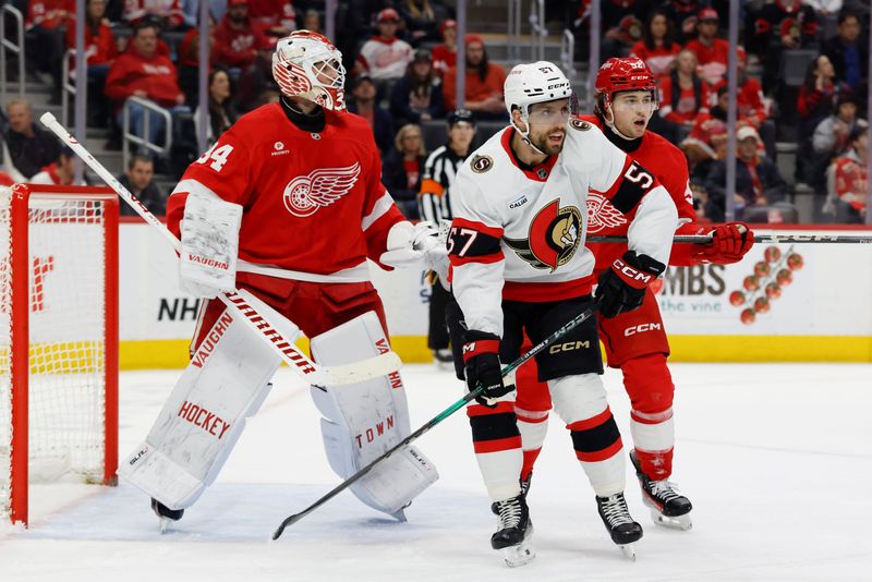 Ottawa Senators left wing David Perron (57) and Detroit Red Wings center Marco Kasper (92) fight for position in front of goaltender Alex Lyon (34) in the first period at Little Caesars Arena in Detroit on Thursday, March 27, 2025.
