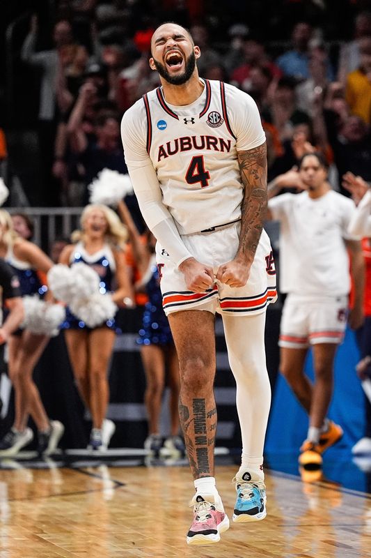 Johni Broome celebrates a play against Michigan State during the Elite Eight in Atlanta, March 30, 2025.