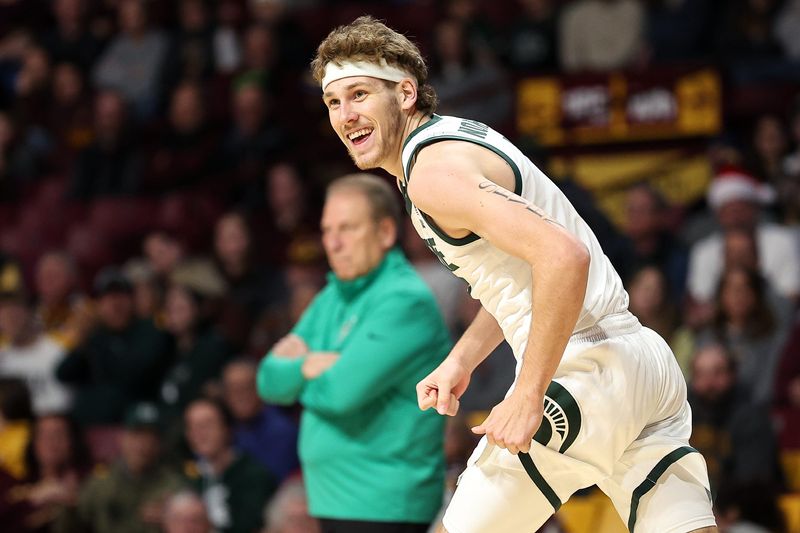Dec 4, 2024; Minneapolis, Minnesota, USA; Michigan State Spartans guard Gehrig Normand (7) celebrates his three-point basket against the Minnesota Golden Gophers during the second half at Williams Arena. Mandatory Credit: Matt Krohn-Imagn Images