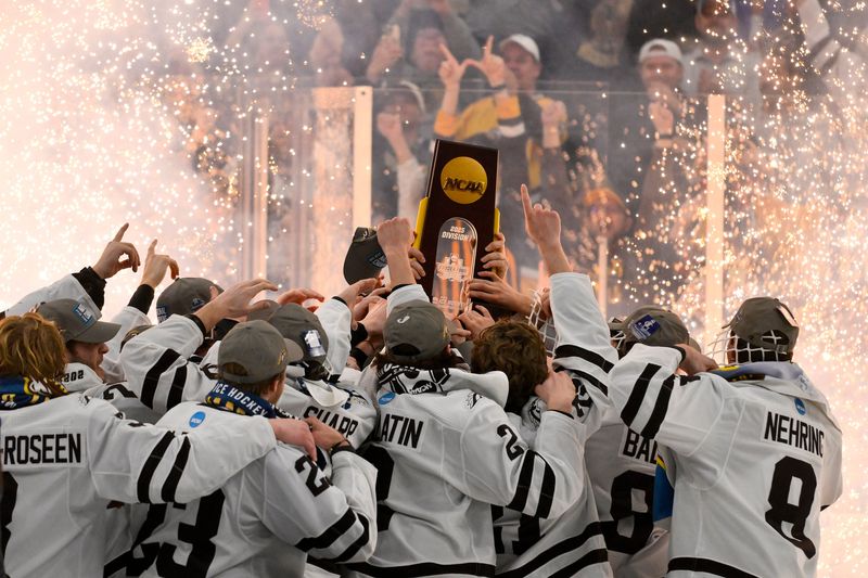 The Western Michigan Broncos hoist the national championship trophy after defeating the Boston University Terriers to win the Frozen Four college ice hockey national championship at Enterprise Center, April 12, 2025 in St. Louis.