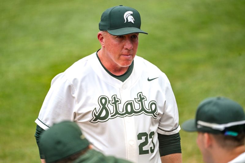 Michigan State's head coach Jake Boss Jr. heads to the dugout during the seventh inning in the game against Ohio State on Friday, April 18, 2025, at McLane Stadium in East Lansing.