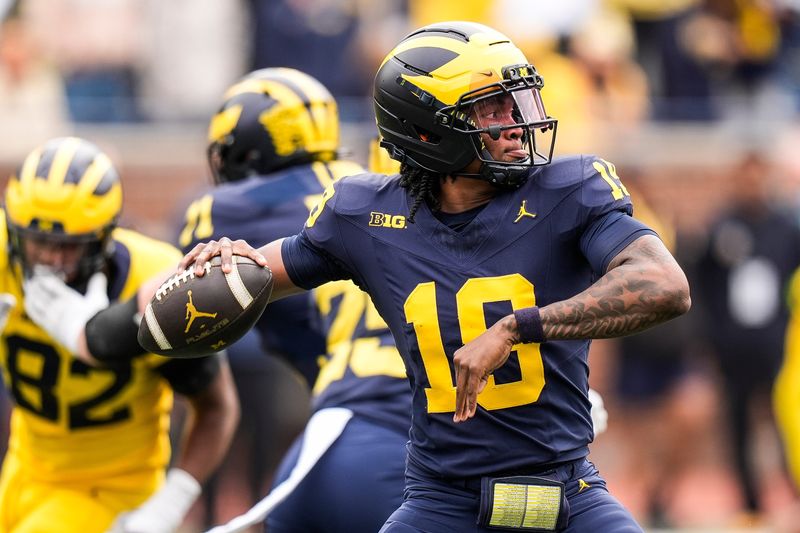 Team Blue quarterback Bryce Underwood (19) makes a pass against Team Maize during the first half of the spring game at Michigan Stadium in Ann Arbor on Saturday, April 19, 2025.