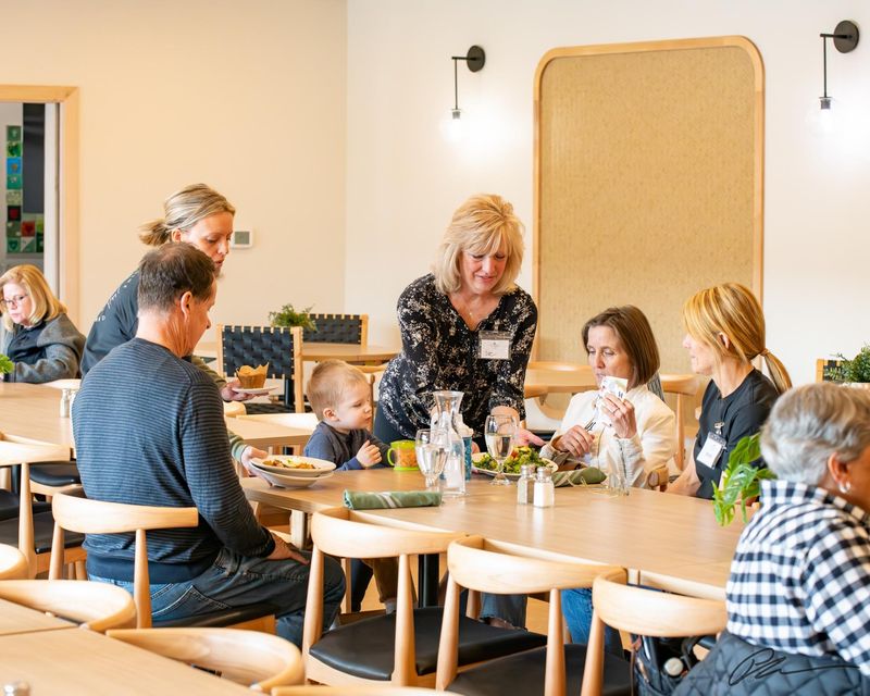 Volunteers serve customers at the Ivy Table’s soft opening on April 15.