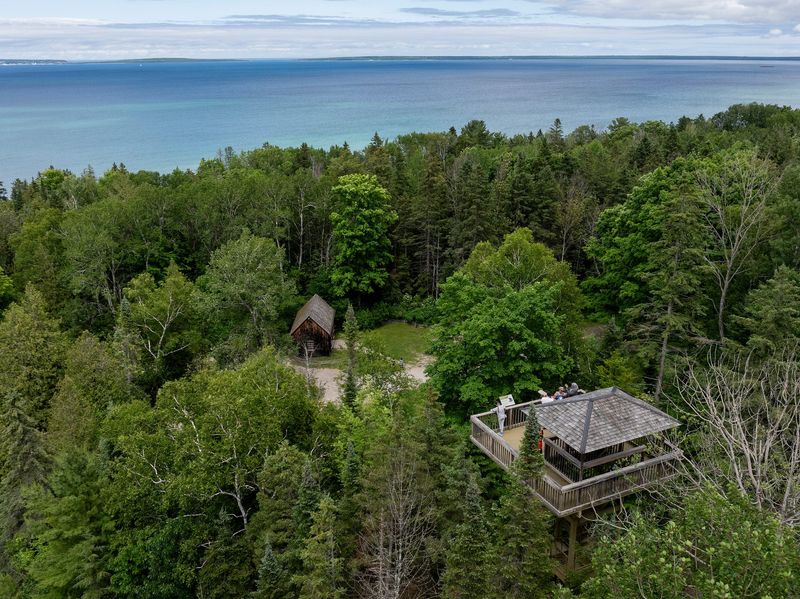 Visitors check out the view from the Treetop Discovery Tower at Historic Mill Creek Discovery Park in Mackinaw City, MI, Tuesday, June 25, 2024.