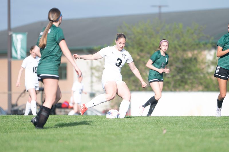 Marshall sophomore Lola Saber takes a shot on goal during a game at Pennfield High School on Wednesday, Apr. 23, 2025.