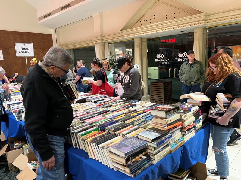 Shoppers peruse fiction hardcovers at Bookstock, metro Detroit's largest used book and media sale, on April 27, 2025.