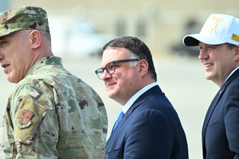 Speaker of the House Matt Hall and Senate Republican Leader Aric Nesbitt arrive at Selfridge Air National Guard Base to welcome President Donald Trump during a visit to a rally in Warren, Michigan on April 28, 2025.