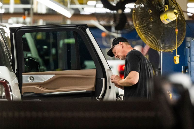 Employees at Ford's Kentucky Truck Plant work to assemble vehicles. The plant is one of four Ford Motor Co. truck plants that won't shutdown for a week this summer in order to make up for lost production stemming from an aluminum shortage.