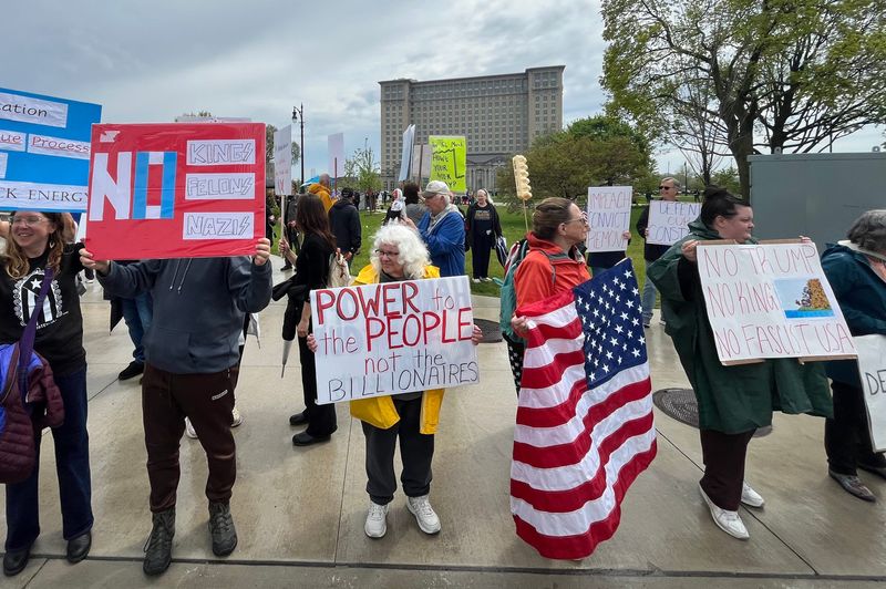 Protesters gather at Roosevelt Park in Detroit’s Corktown neighborhood to mark May Day by protesting President Donald Trump’s policies on Thursday, May 1, 2025.