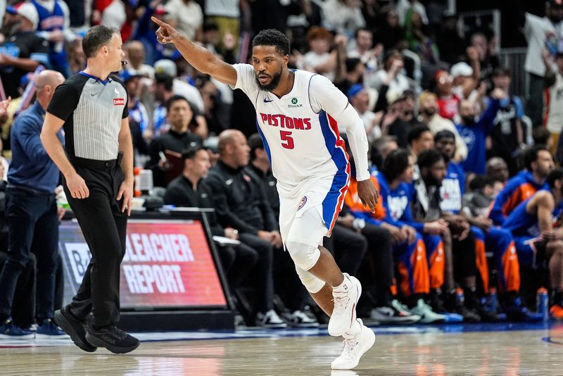 Malik Beasley celebrates Detroit Pistons possession against the New York Knicks during the first half of Game 6 of an Eastern Conference playoff first-round series at Little Caesars Arena in Detroit on Thursday, May 1, 2025.