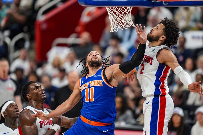 New York Knicks guard Jalen Brunson shoots a layup against Detroit Pistons guard Cade Cunningham (2) and center Jalen Duren (0) during Game 6 of the first round of the NBA playoffs at Little Caesars Arena in Detroit, May 1, 2025.