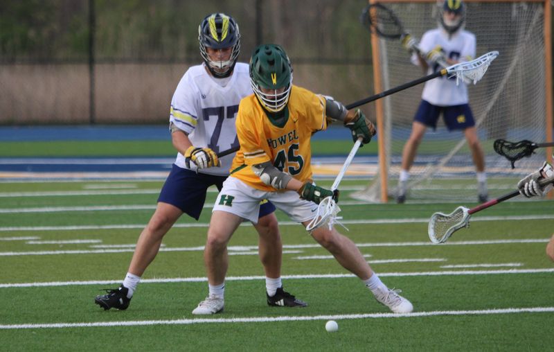 Howell's Cody Baker (45) and Hartland's Max Kotsilidis (77) are among the all-KLAA boys lacrosse selections.