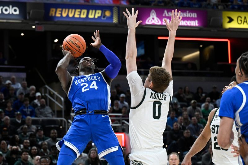 Nov 15, 2022; Indianapolis, Indiana, USA; Kentucky Wildcats forward Chris Livingston (24) shoots the ball over Michigan State Spartans forward Jaxon Kohler (0) during the first half at Gainbridge Fieldhouse. Mandatory Credit: Marc Lebryk-USA TODAY Sports
