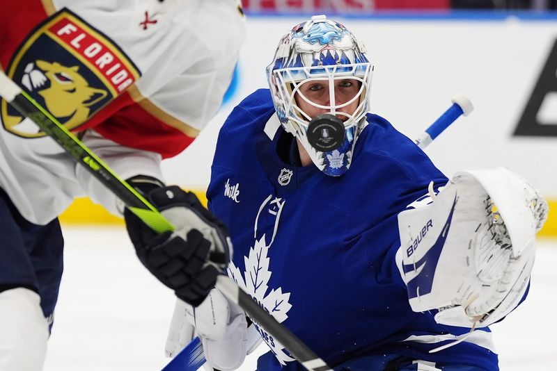 Maple Leafs goaltender Joseph Woll (60) keeps his eyes on the puck during the third period of Wednesday's game against the Panthers in Toronto.