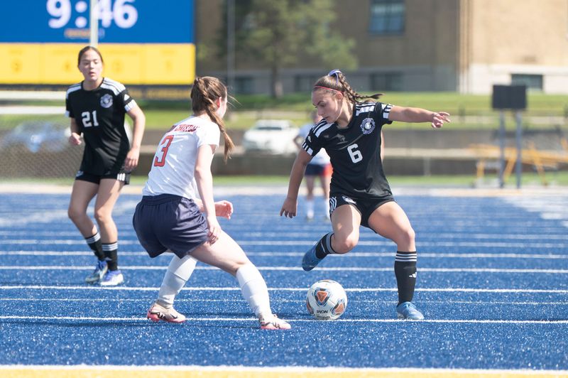 Calhoun Christian senior Ally Bandeen defends against Lakeview junior Lilamae Frank during an All-City playoff game at Battle Creek Central High School on Saturday, May 10, 2025.