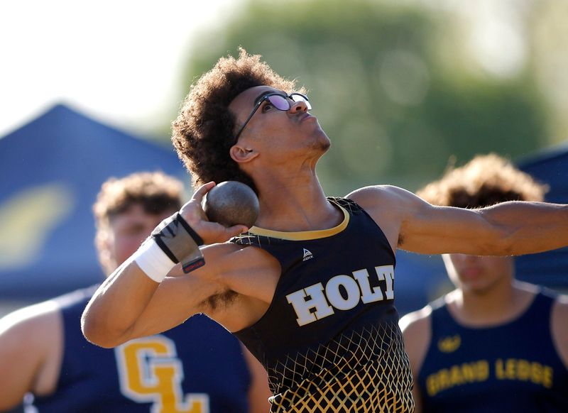Holt's Carl Flinton throws the shot put during the Division 1 MHSAA track and field regional, Friday, May 16, 2025, at Mason High School.