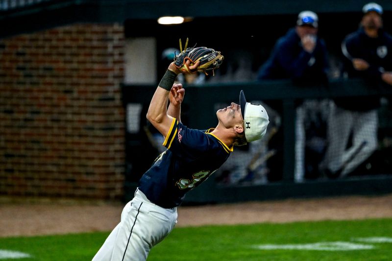 DeWitt's Joe Zubal catches a Lansing Catholic ball for an out in the firth inning on Monday, May 19, 2025, during the Diamond Classic game at McLane Stadium in East Lansing.