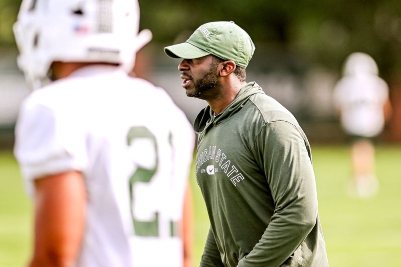 Michigan State's secondary coach Blue Adams works with players during the first day of football camp on Tuesday, July 30, 2024, in East Lansing.