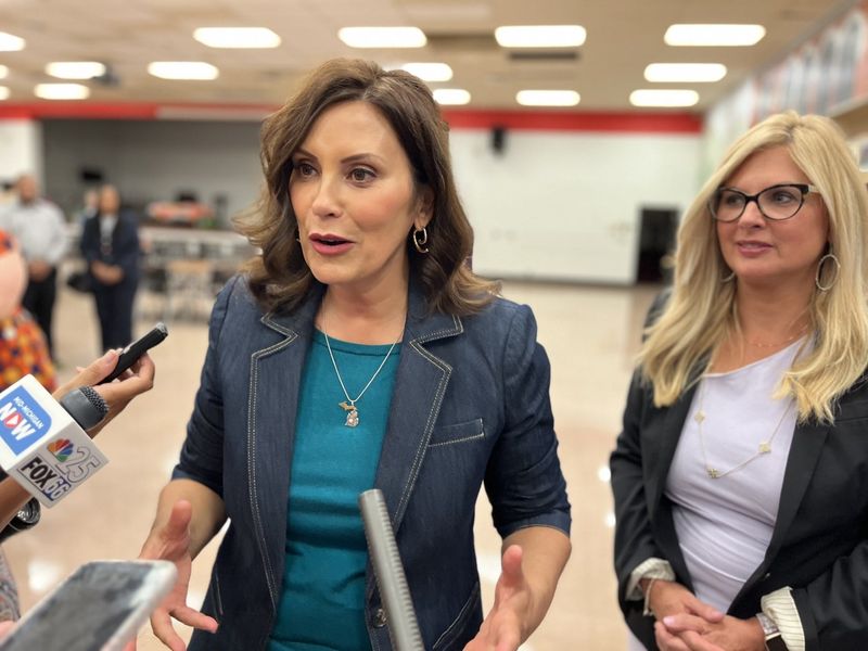 Michigan Gov. Gretchen Whitmer speaks to reporters at Flint Beecher High School in Flint, Mich. on Tuesday, Aug. 29, 2023.