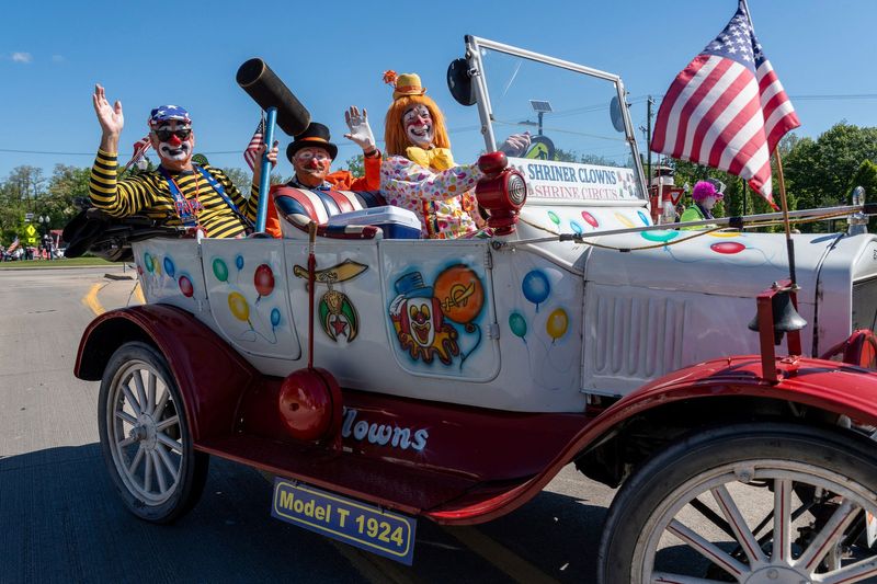 Members of the Detroit Shriners wave during the Memorial Day parade in Sterling Heights on Monday, May 26, 2025.