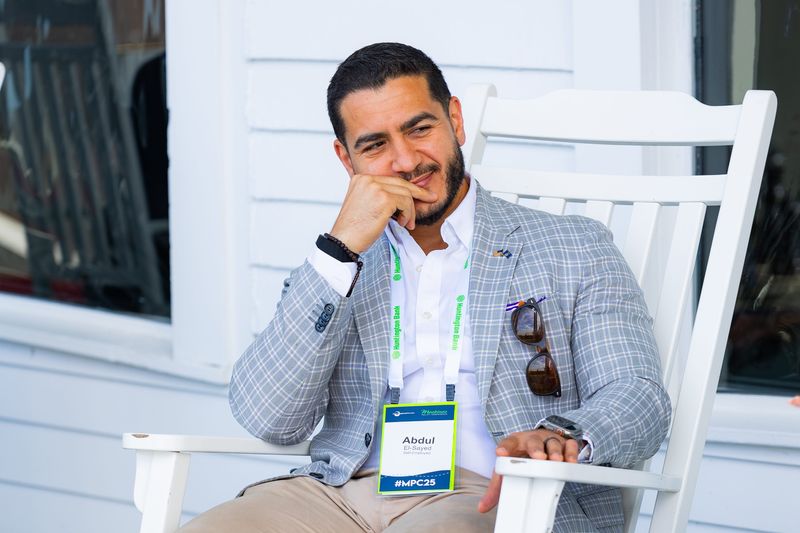 Abdul El-Sayed, Democratic candidate for U.S. Senate, is interviewed on the porch at the Grand Hotel during the 2025 Mackinac Policy Conference on May 28, 2025 on Mackinac Island. El-Sayed says he has attended multiple Mackinac conferences while he was a public health official for the City of Detroit and Wayne County, but has never vacationed on the island.