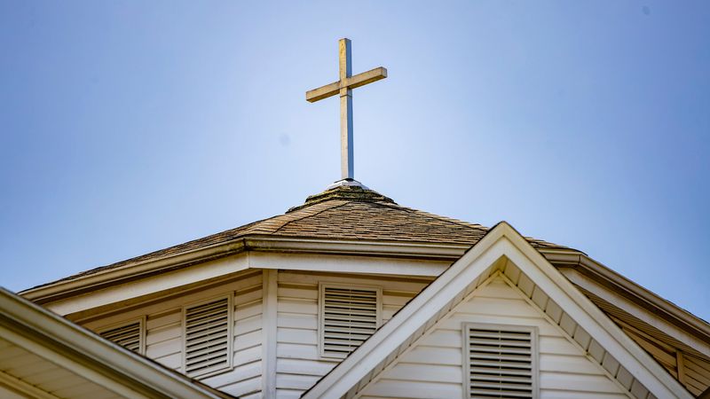 A cross sits atop West Asheville Presbyterian Church in West Asheville, May 28, 2025.