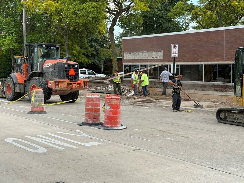 G.V. Cement workers remove the Monroe City Hall wall, which was over 50 years old and in need of replacement.