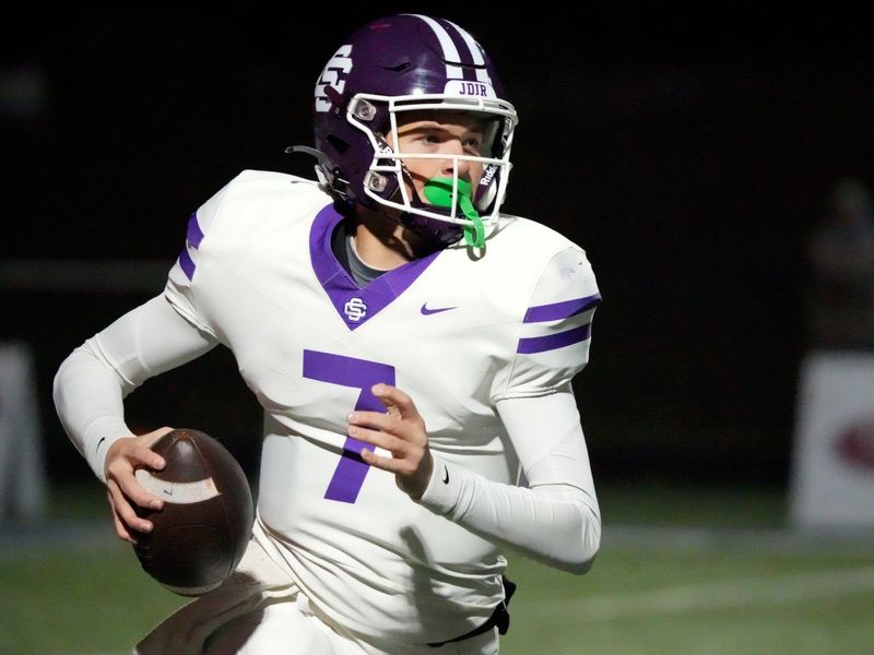 Sevier County's Cooper Newman (7) looks for an open receiver during the TSSAA high school football playoff game between against West on Friday, Nov. 22, 2024, in Knoxville, Tenn.