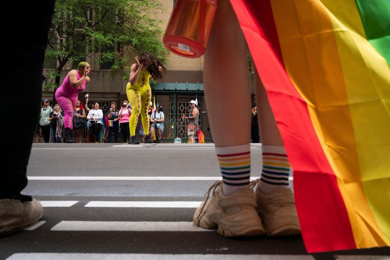 Parade-goers watch as dancers perform a routine during the annual Motor City Pride Parade in downtown Detroit on Sunday, June 11, 2023.