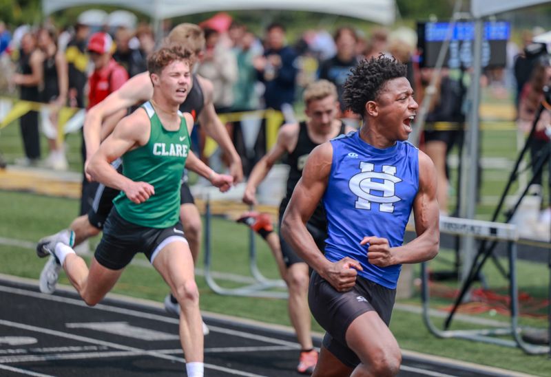 Harper Creek's DJ Wood celebrates as he crosses the finish line to win a state title at Division 2 state track championships at Hamilton High School on Saturday, May 31, 2025.