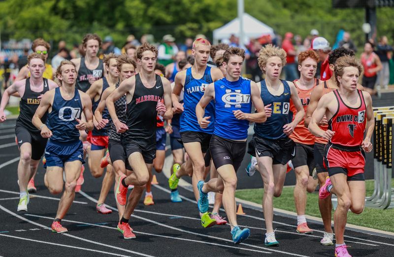 Harper Creek's Dominic Lowrie and Marshall's Jack Bidwell compete in the 1,600 at Division 2 state track championships at Hamilton High School on Saturday, May 31.